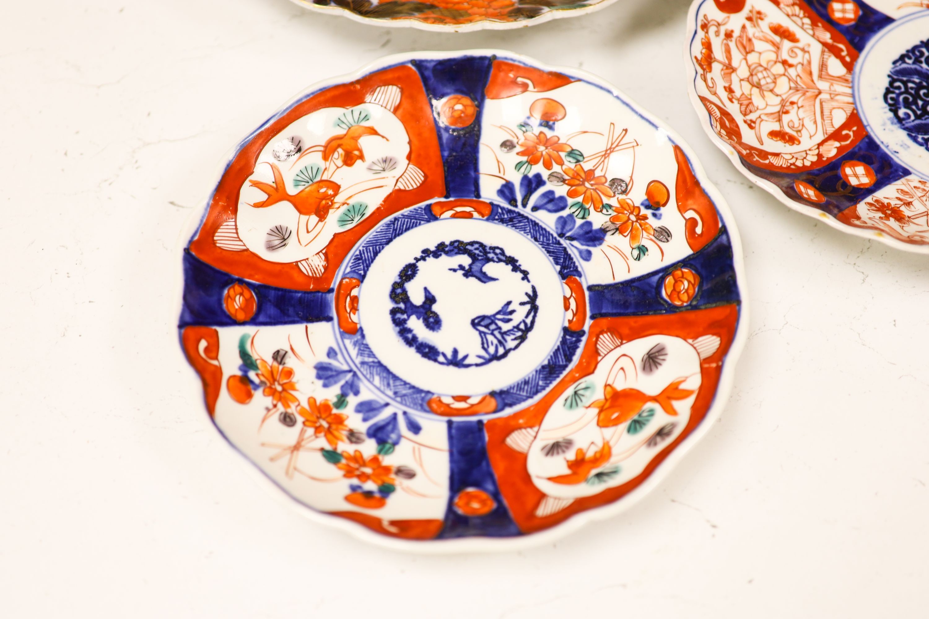 Five Japanese Imari dishes, largest 30.5 cm